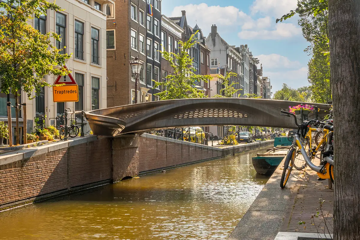 3D-printed metal bridge in Amsterdam over a historic canal.